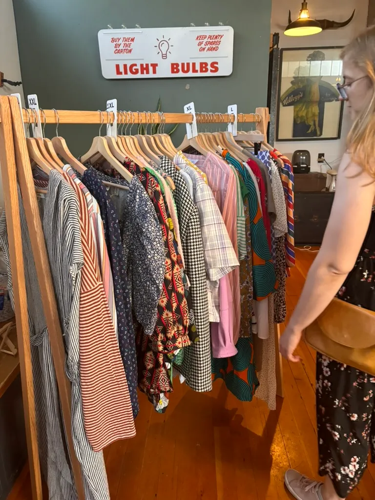 Curated clothing rack with size dividers from L through XXL